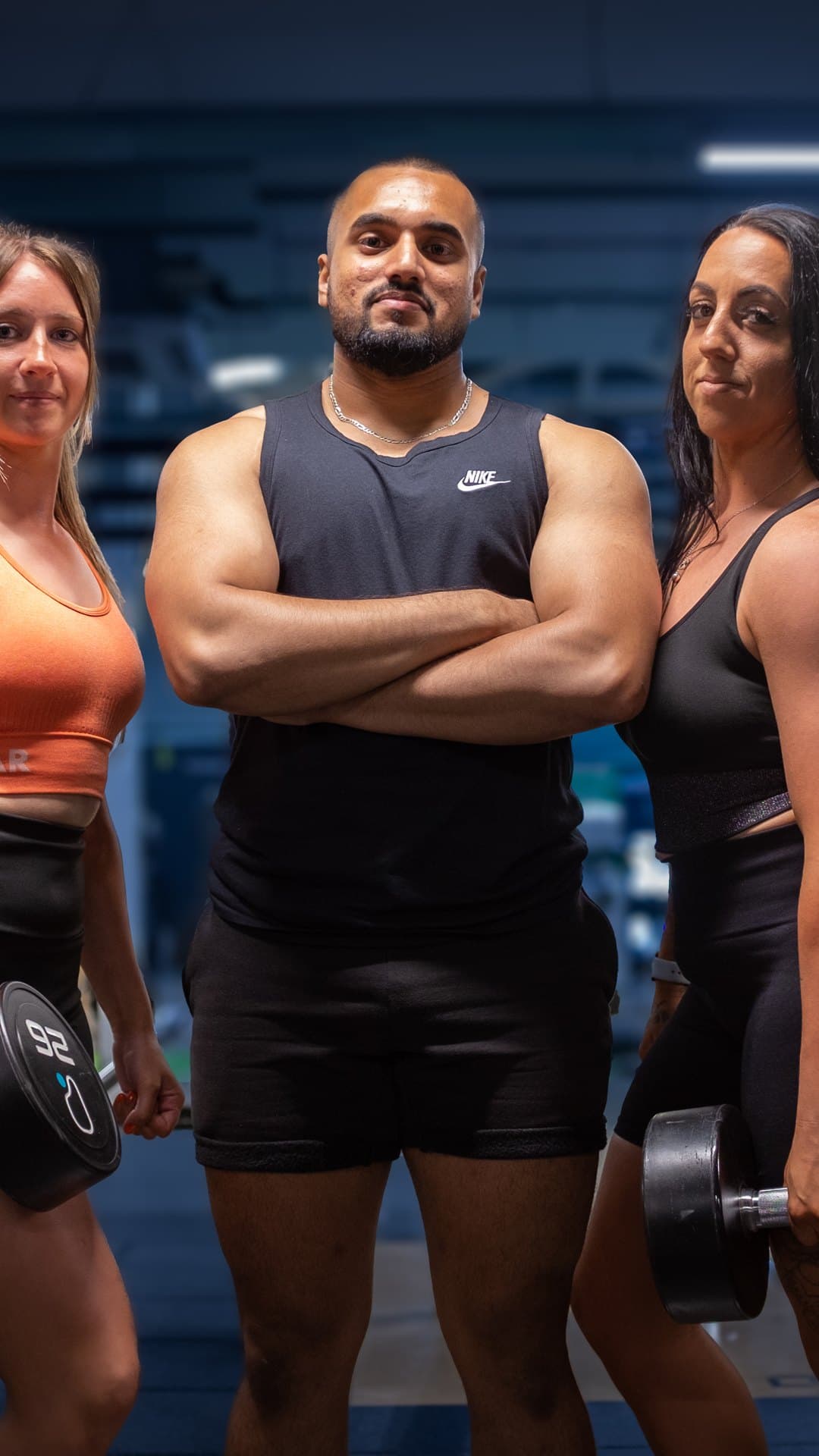 Rashed Rahman, RR Strength coach, with two clients in the gym