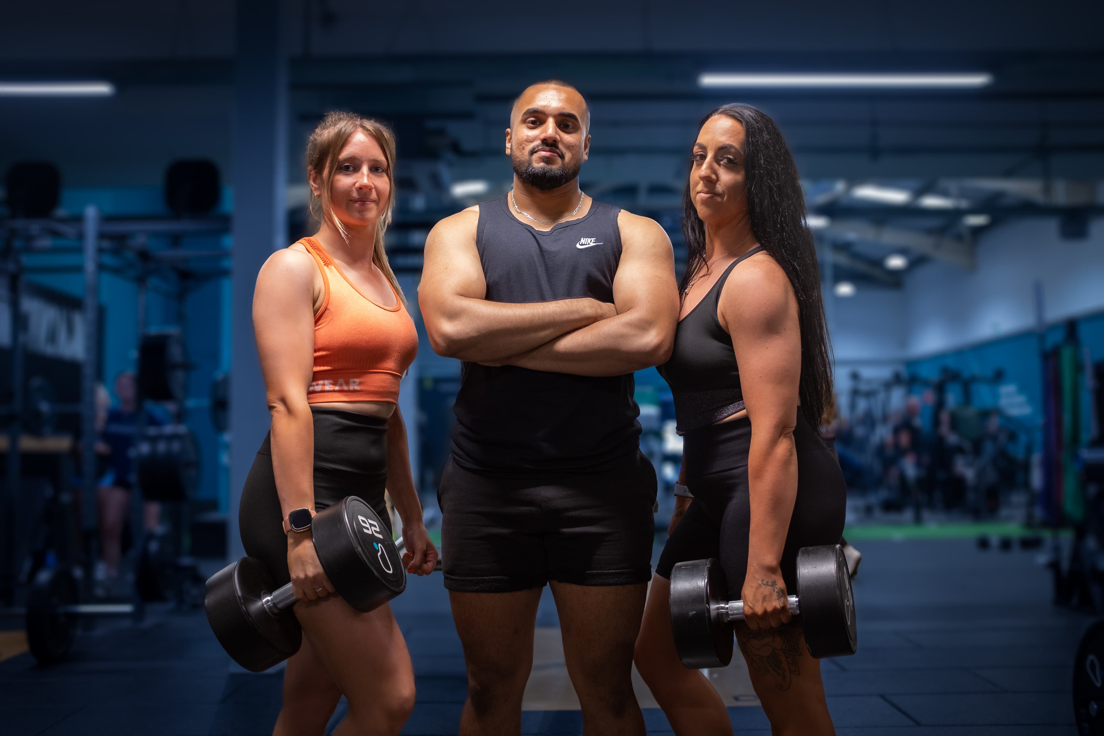 Rashed Rahman, RR Strength coach, with two clients in the gym